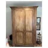 Beautiful Entertainment Cabinet  measuring 66” x 26” x 100”.  Very heavy and will need to be removed through patio doors. Bring help to move. Contents not included.