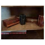 Two dresser boxes 9 1/2“ x 3 1/2“ and 9“ x 3“ and two vintage insulators, green and brown both 7 inches tall