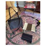 Three purses; a black clutch, a black Kate Spade and an animal print and Louis Vuitton crossover purse