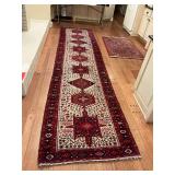 Oriental Hand Woven Wool Rug in red and creams.. 42“ x 174. Good condition..