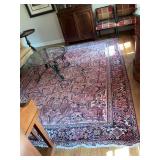 Oriental hand woven wool rug in pink and blues. 8 foot x 11 foot.