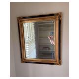Black and gold trimmed beveled glass mirror 27” x 31”