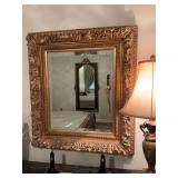 Very ornate gold trimmed beveled glass mirror 31 1/2“ x 34 1/2“.  4”thick