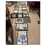 Group of 16 mixed size black picture frames and one gold frame