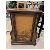 Zebra leather and wicker look side table with magazine racks on each side. 21“ x 12 1/2“ x 27 1/2“. ￼