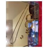3 pair of earrings (￼the hoop earrings are Monet), gold chain with a 12 karat gold cross ￼