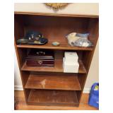 Four shelf bookcase by 10 1/2“ x 47 1/2“.  Contents, not included.