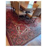 Oriental hand woven wool rug in green and red colors￼. 12 foot 6 x 10‘.