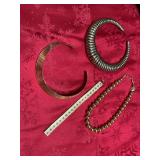 Four pieces of gold costume jewelry