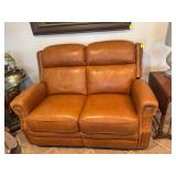 Double reclining electric tan leather loveseat with brads. -From Stash- 60” x 40” x 41” 20 inches from floor . Has foot and head reclining features.