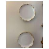 Set of 4 Haviland France 6 inch white, gold trimmed plates. Flaw on edge of one as shown in photos.