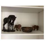 Hand carved wooden jungle animals. Mama giraffe and her baby is 12” x 11”. The hand carved bowl is 9 inches round and the lion and rhinoceros is 7” x 5”..