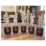 Set of (5) bone or ivory carved musicians on wooden barrels…..(1) is missing his cello and one playing accordion has been repaired…..6-1/4” tall