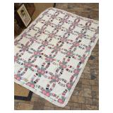 Vintage Wedding Ring Pattern hand sewn quilt…..in good condition…..approx. 60 x 85-1/2…..small stain