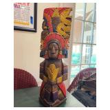 Vintage hand-carved and painted wooden Mayan Aztec-inspired totem pole statue with natural earthy tones of blue, red, brown, and yellow…..8”w x 25-1/4” tall