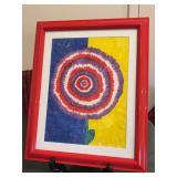 Vibrant and colorful children’s tie-dye rendering of a flower…..colors are fabulous and highlighted by red framing…..13 x 16….it is signed but unable to make out signature