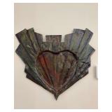 Decorative metal wall sculpture featuring a central heart shape with green and bronze patina tones…..22 x 19-1/2…..handcrafted by Leila Hamdan 07 at the Ornamental Metal Museum