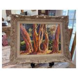 Great looking gilt framed and signed (Sophie) landscape oil on canvas print focusing on the textured trunks and foliage of a grove of trees…..22 x 18
