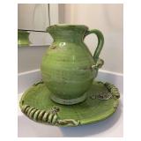 Stunning unmarked pottery bowl & pitcher set featuring grapevine motif…..bowl measures 17-1/4”D x 3” tall and pitcher stands 12-1/4” tall….both are heavy pottery pieces