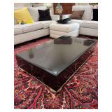Art Deco Black Lacquered Coffee Table with distressed wooden feet…..49 x 29 x 12” tall….top needs cleaned