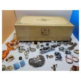 Vintage Mele two-tier jewelry box, full of unique vintage costume jewelry.