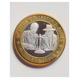 Sam's Town Western Collector's Series gaming token. The central portion of the token is crafted from .999 fine silver.
'Weighing Gold' design.  Generally $10 gaming tokens used in slot machines.