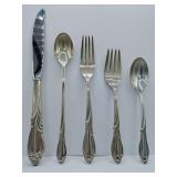 Sterling 'Rhapsody' flatware 5 piece place setting, knife, dinner fork, salad fork, dinner spoon, tea spoon. Weighs 174 grams. Introduced in 1957 by International Silver. The design features sweeping,