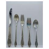 Sterling 'Rhapsody' flatware 5 piece place setting, knife, dinner fork, salad fork, dinner spoon, tea spoon. Weighs 174 grams. Introduced in 1957 by International Silver. The design features sweeping,