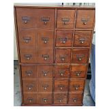 Two-door, 12 drawer CD/DVD cabinet. 27x7x42 in tall.