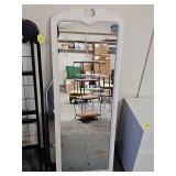 Floor length mirror in white frame. No stand. 20 x 56 in tall.