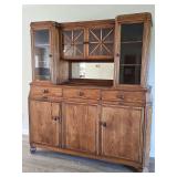 Beautiful antique cabinet with glass door storage on the top and three drawer, three door storage on the bottom. Previously used as a liquor cabinet. 70X22x77 in tall. Mirror is not cracked. It is mis