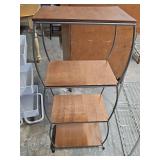 Four shelf stand with metal frame and wood shelves. 17 x 10.5 x 40.5 in tall.