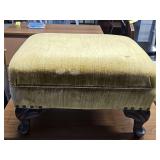Vintage/antique green velvet footstool with ornate feet. Under strapping is copper. 19x16 X12 in tall.