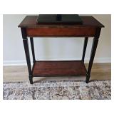 Console table. 30 x 14 x 29 in tall. TV is not included.