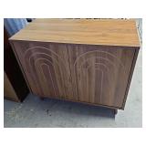 Simulated wood two-door cabinet. 31.5 x 16x 27 in tall.