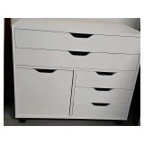 Small chest on wheels. Lower right drawer needs repair as shown. 31 x 16 x 26.25 in tall.
