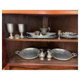 Contents of bottom of corner cabinet….hammered aluminum trays, pewter creamer/sugar, pewter serving trays and more