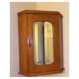 Vintage wood corner cabinet with mirrored door and 2 shelves…..22-1/2” tall