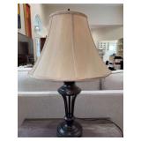 Nice looking bronze-like finish lamp with beige silk-like shade…..24” tall