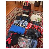 Large grouping of duffel bags, tote bag, clear NFL bag and more