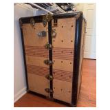 Vintage Oshkosh steamer wardrobe trunk from the early 20th century - considered to be a high-end travel piece designed for luxury ship travel…..21-1/2w x 22 deep x 43 tall….measurements are as it 