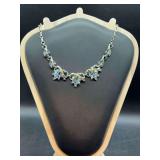 Vintage Coro silvertone necklace featuring marquise and baguette aurora borealis rhinestones in a floral or leaf design