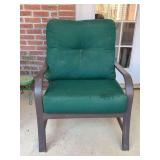 Black metal patio arm chair with thick green cushions…..29-3/4 x 16 x 19-1/2 tall to seat (36 tall overall)…..both need cleaning from dust & pollen from sitting on patio….no staining - cushion h