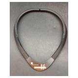 Black, stylized collar featuring a geometric acrylic white inlay