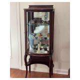 Vintage mahogany curio cabinet with a curved glass front, mirrored back, and glass shelves….CONTENTS NOT INCLUDED…..20 x 13 x 52-1/4 tall