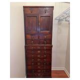 Antique stacking multi-drawer dental cabinet…..bottom measures 26-3/4 x 15 x 38 tall…..top measures 26 x 14-1/4 x 34-1/2…..there is a cut out in the back of the top cabinet