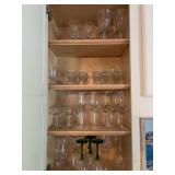 Contents of bar cabinet…..glass stemware