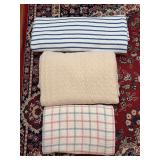 Grouping of (3) blankets…..blue/pink and beige are full/queen…..blue striped is king
