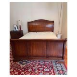 Very nice looking queen size cherry sleigh bed with adjustable mattress…..ONLY THE HEAD OF THE MATTRESS IS ADJUSTABLE…..bed does show blemishes but this is still a beauty and fully functional