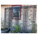 4-panel wrought iron trestle…..each outer panel measures 23-3/4w and each inner panel measures 24”w…..height is approx. 82” tall (with stakes in ground)…..POTS IN FRONT ARE NOT INCLUDED
